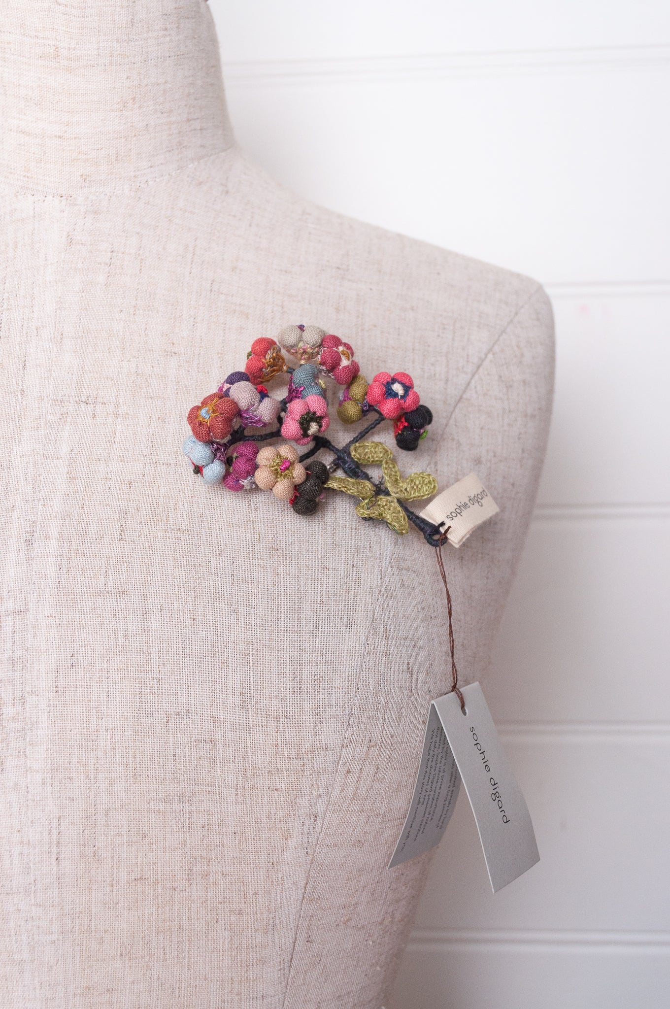 Sophie Digard colourful button flower brooch hand embroidered and crocheted in linen.