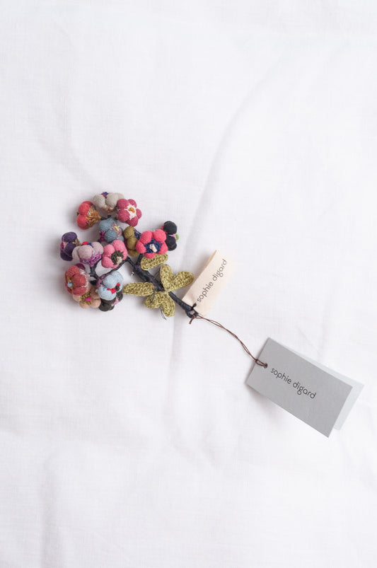 Sophie Digard colourful button flower brooch hand embroidered and crocheted in linen.