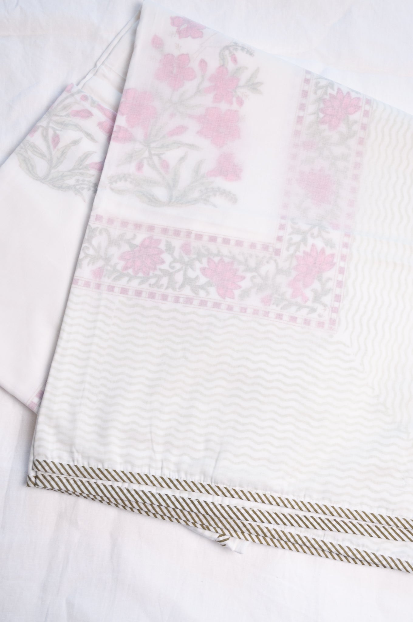 Single size cotton muslin blockprinted dohar, moghul design with pink flowers and cypress trees.