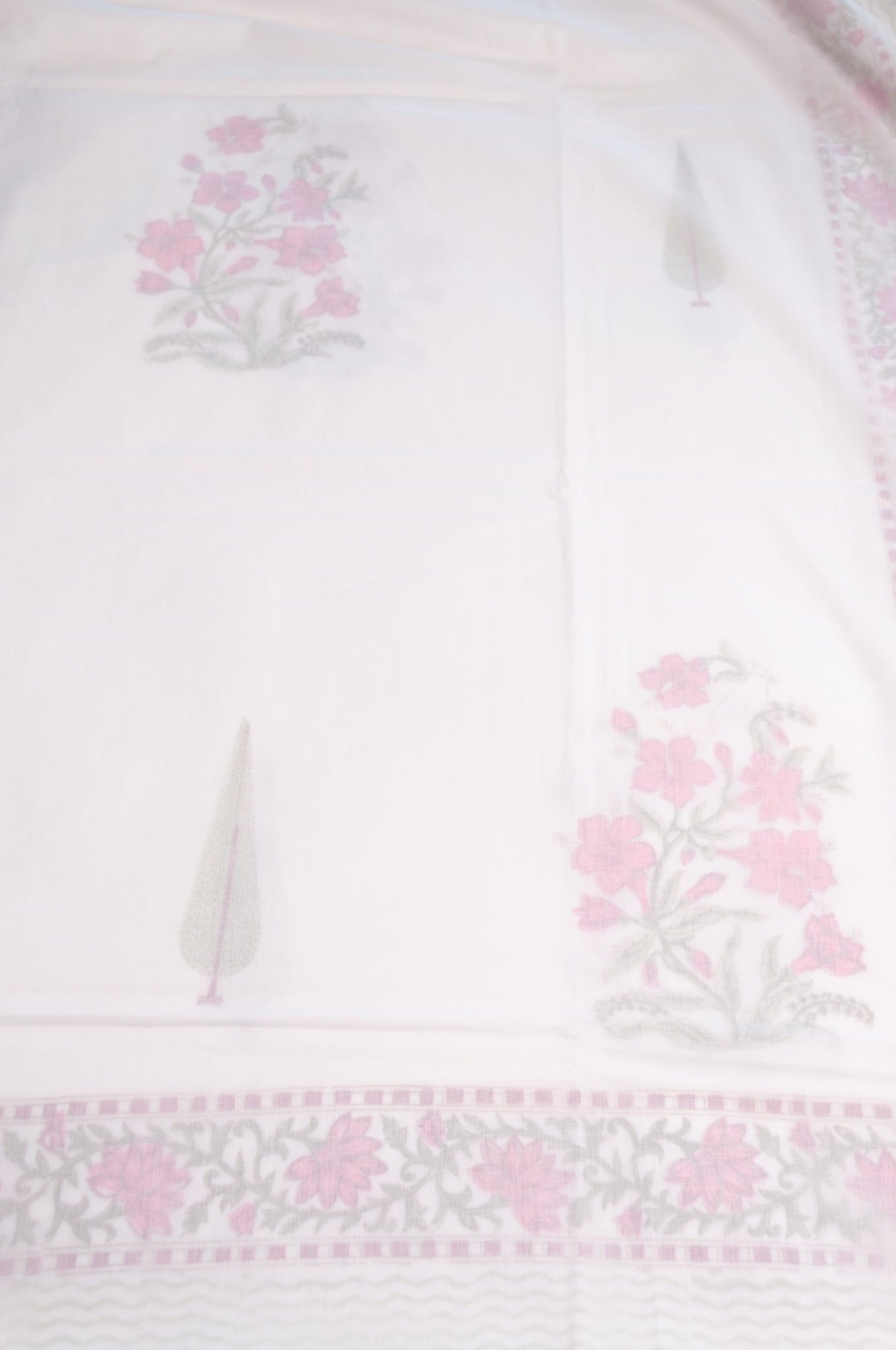 Single size cotton muslin blockprinted dohar, moghul design with pink flowers and cypress trees.