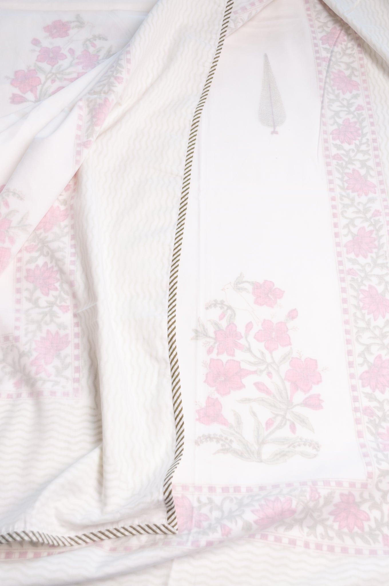 Single size cotton muslin blockprinted dohar, moghul design with pink flowers and cypress trees.