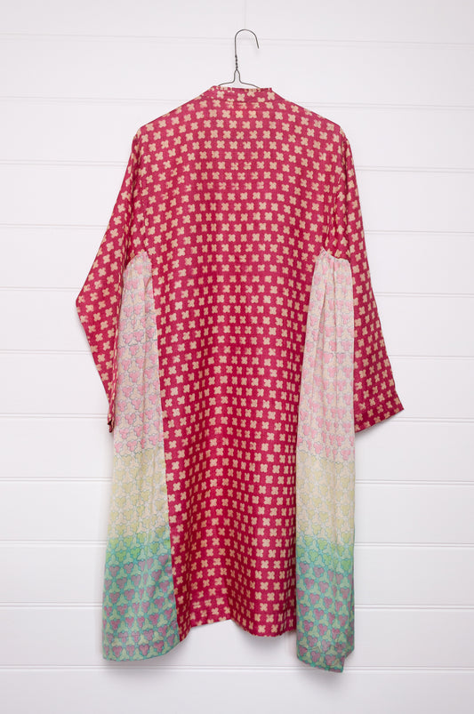 Blockprint tussar and cotton silk button up dress in red with pastel side panels.