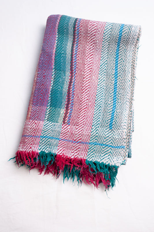 Vintage lohori stitch kantha quilt on multicoloured stripes.