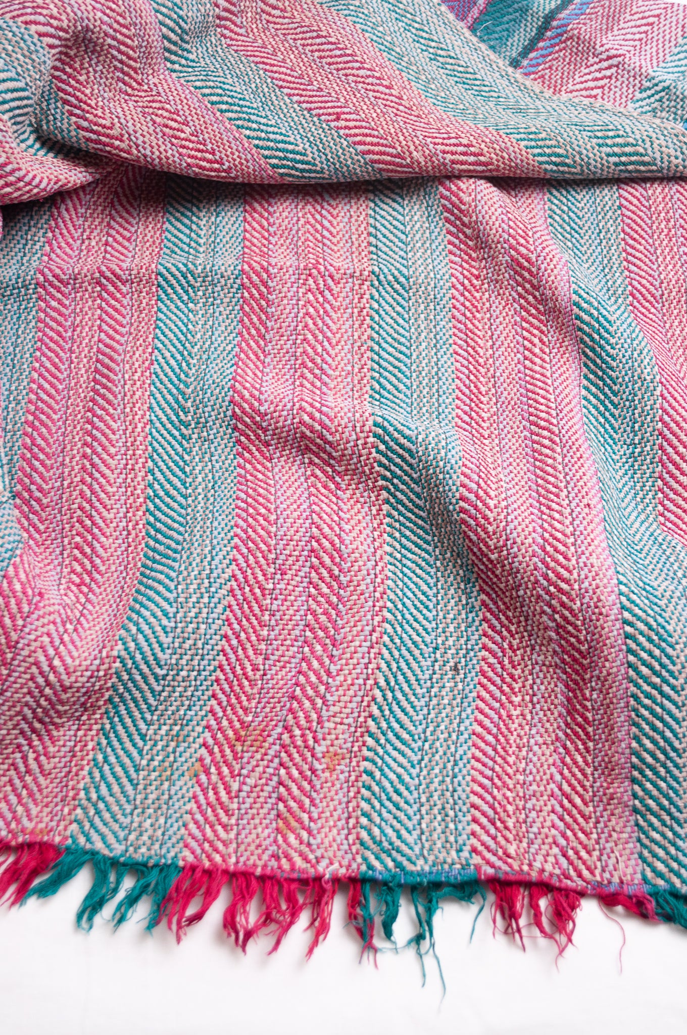 Vintage lohori stitch kantha quilt on multicoloured stripes.