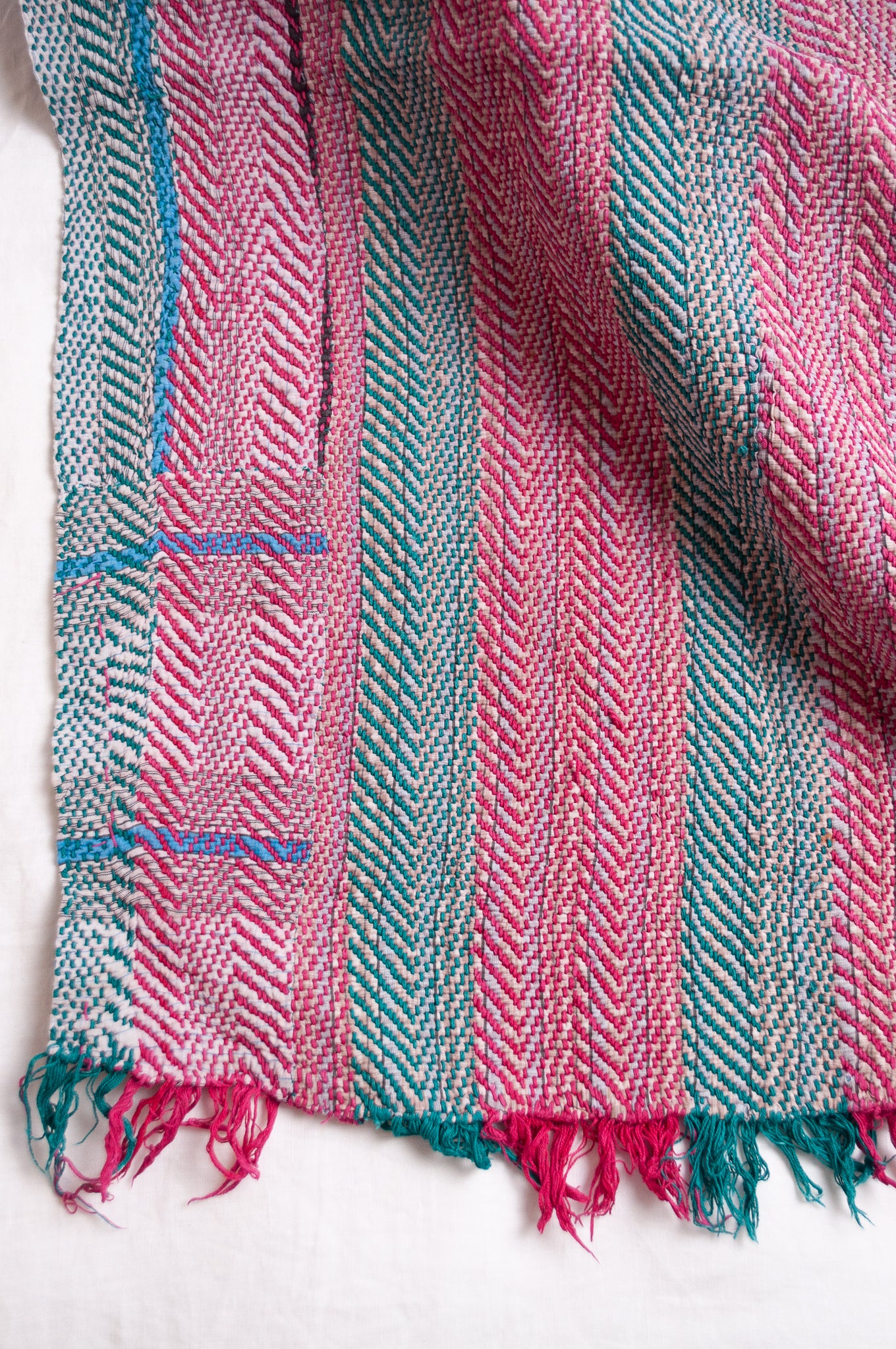 Vintage lohori stitch kantha quilt on multicoloured stripes.