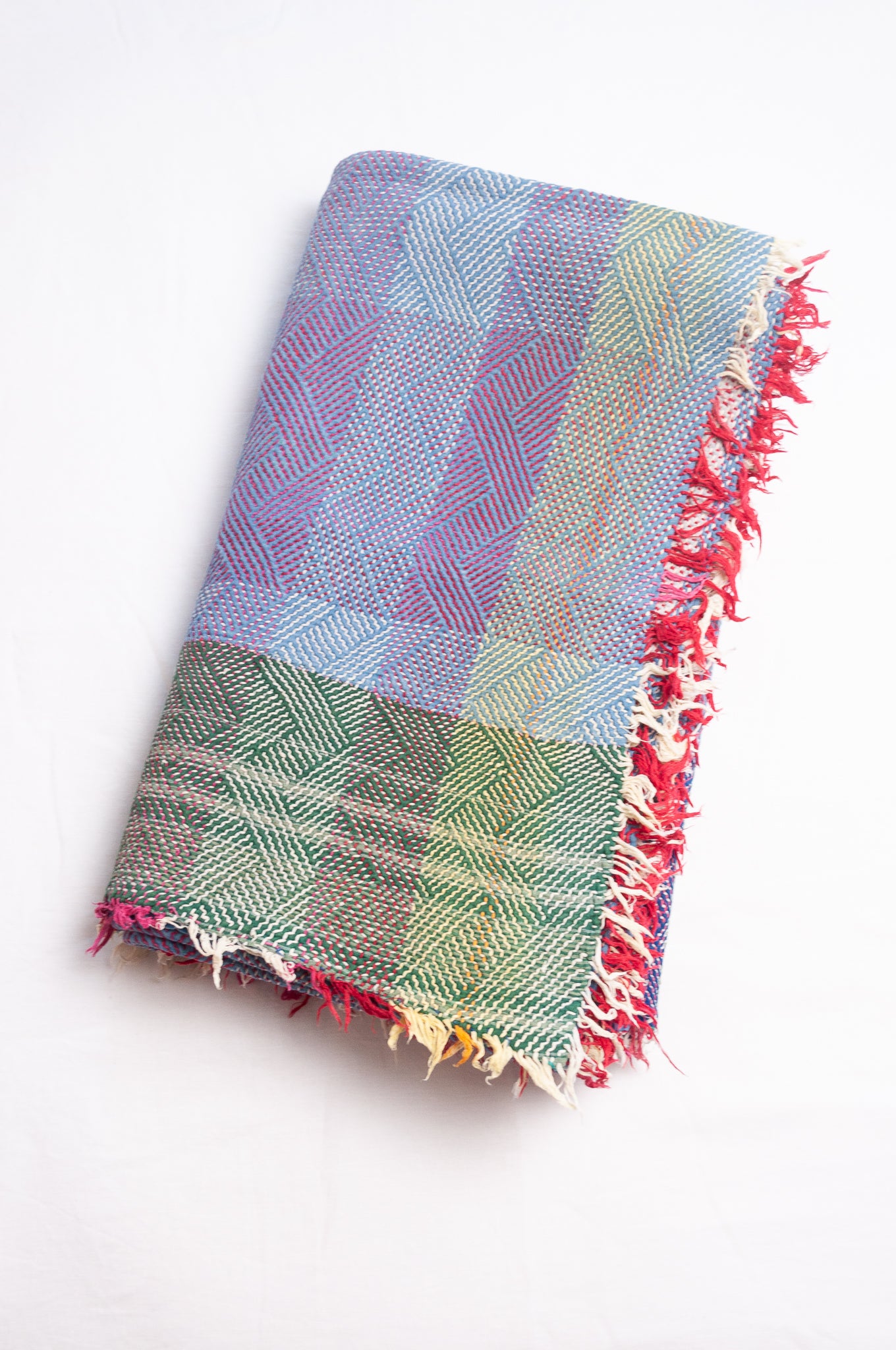 Vintage lohori stitch kantha quilt on multicoloured base.