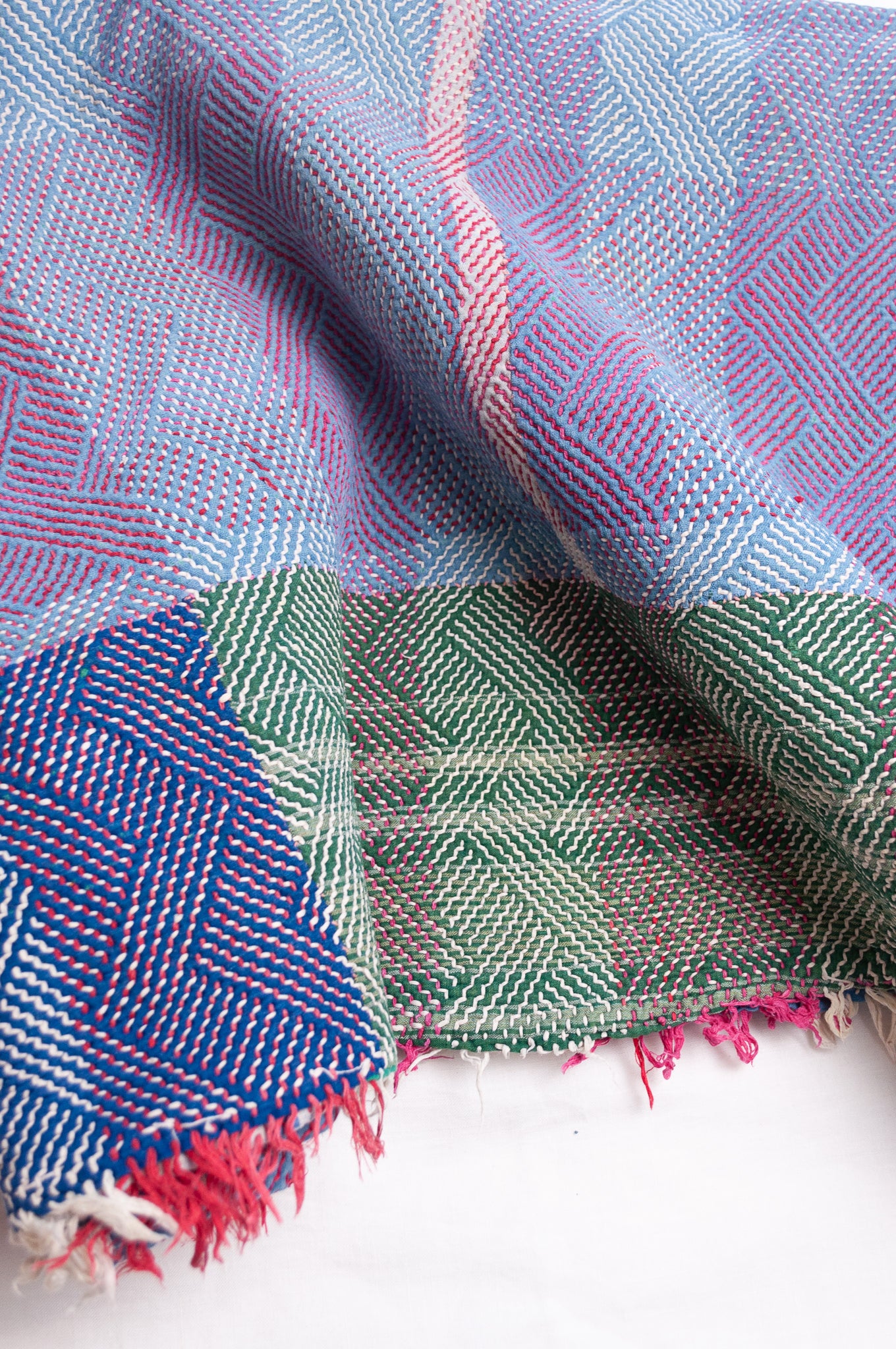 Vintage lohori stitch kantha quilt on multicoloured base.