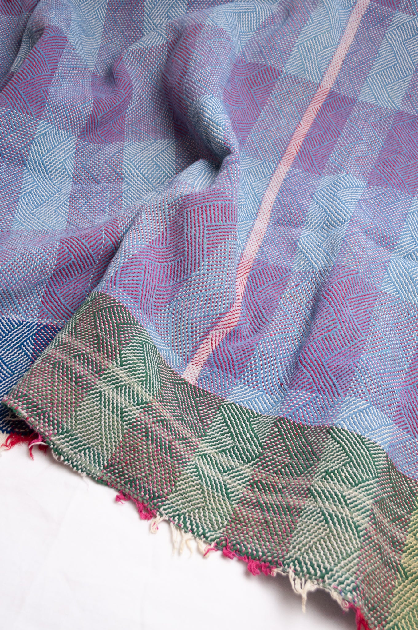Vintage lohori stitch kantha quilt on multicoloured base.