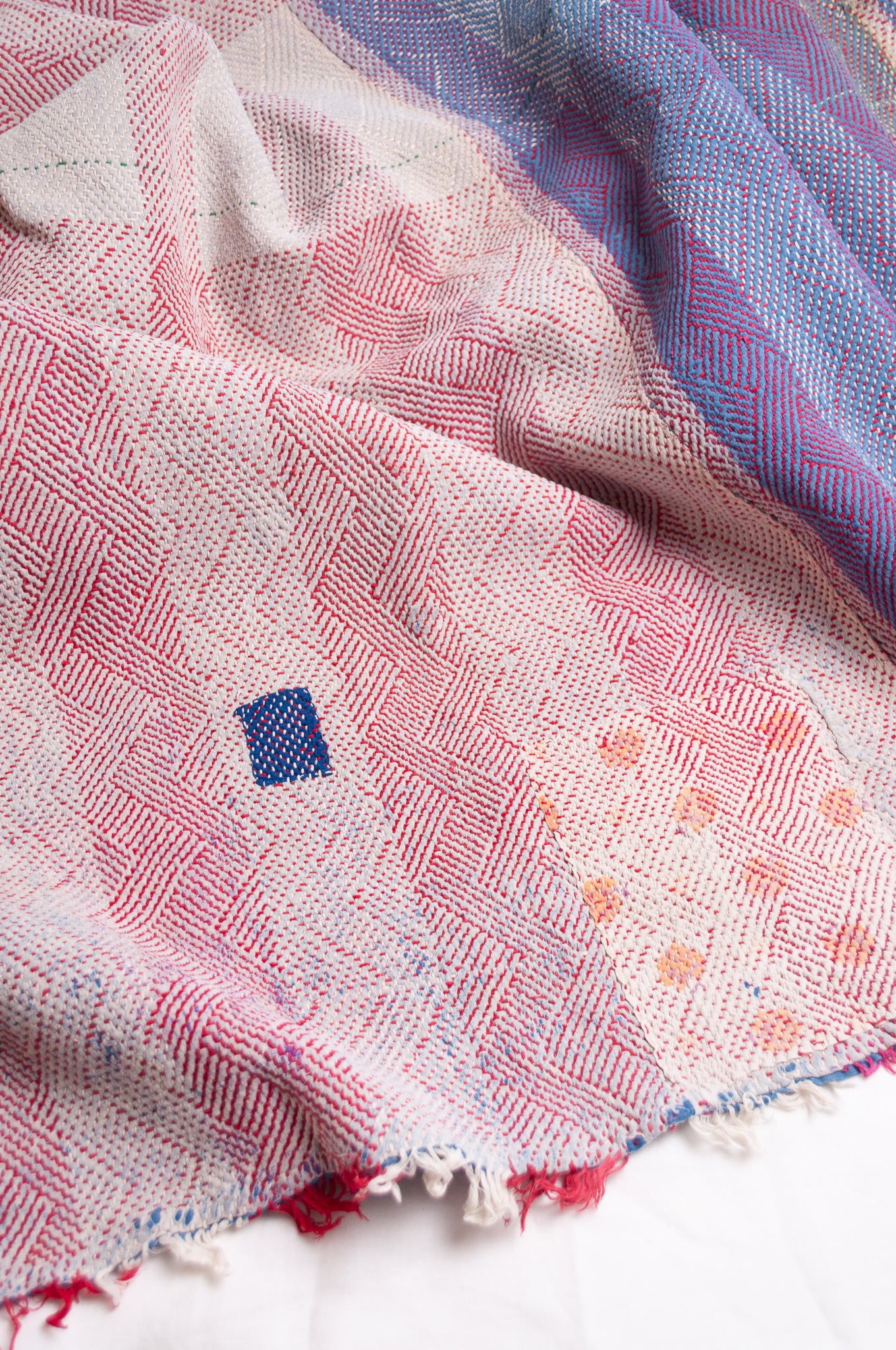 Vintage lohori stitch kantha quilt on multicoloured base.