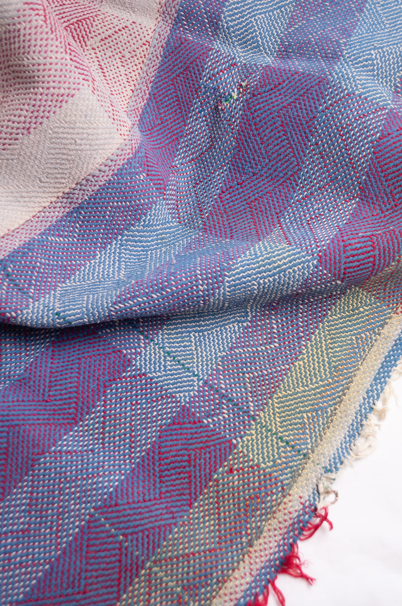 Vintage lohori stitch kantha quilt on multicoloured base.