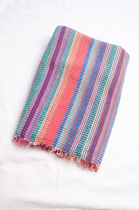 Vintage lohori stitch kantha quilt on multicoloured stripes.