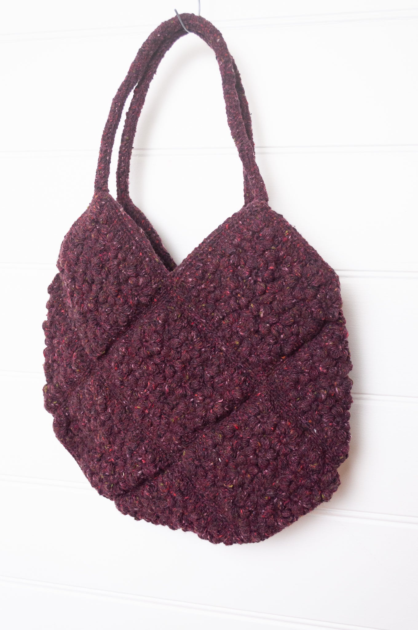 Sophie Digard crocheted freesia flower wool bag in tweedy burgundy.