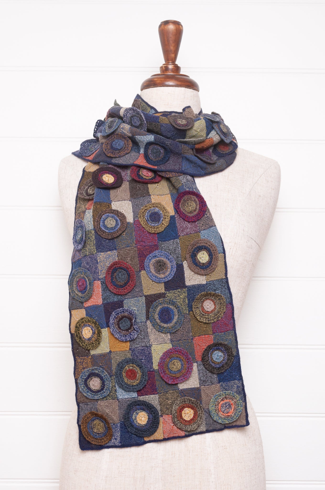 Sophie Digard crocheted wool scarf featuring patchwork with 3D rosettes in ink palette.