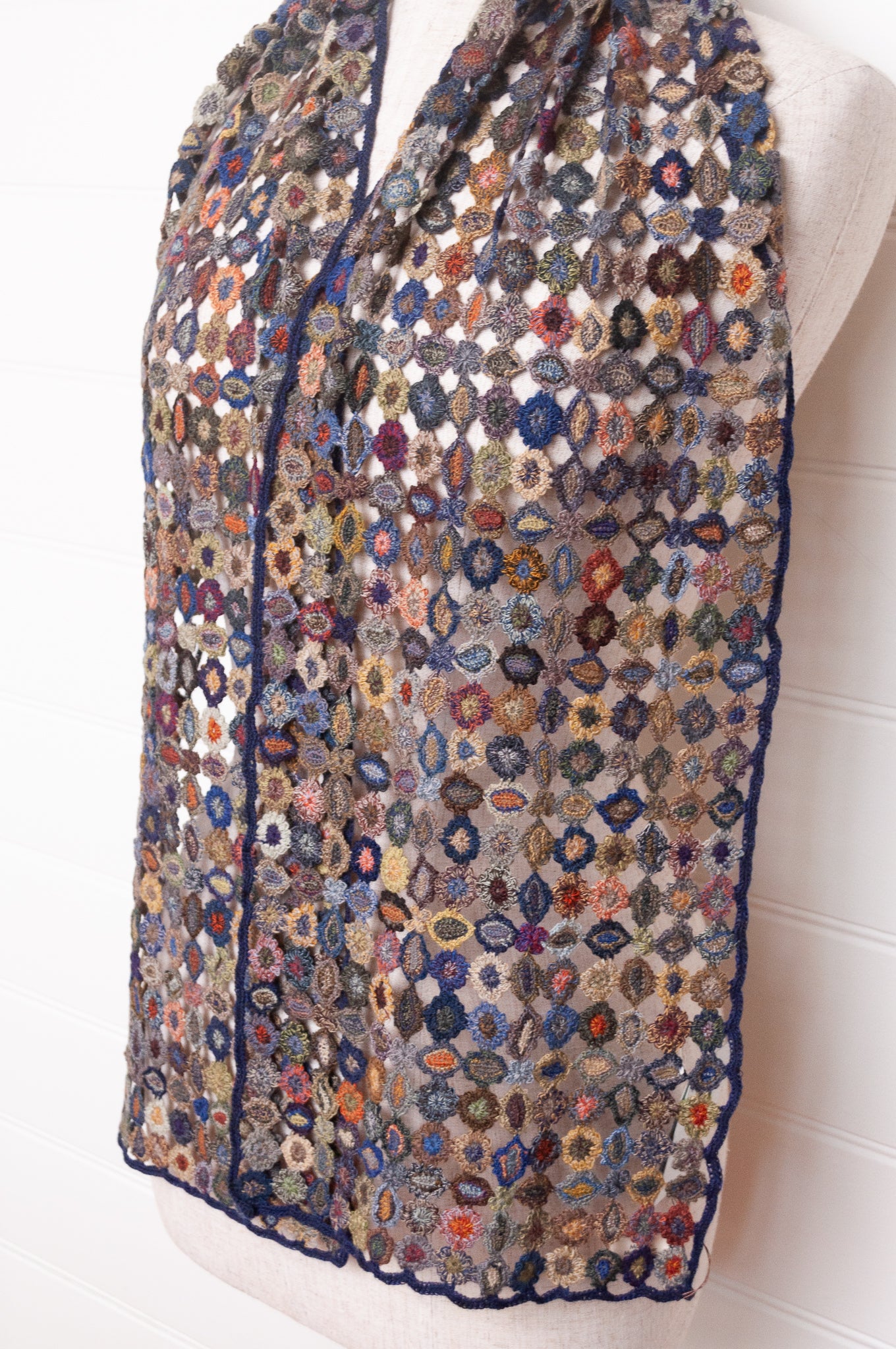 Sophie Digard crocheted wool scarf featuring flower motif lattice in ink palette.