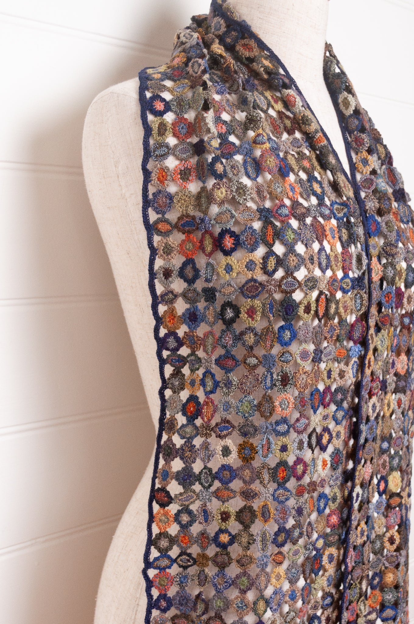 Sophie Digard crocheted wool scarf featuring flower motif lattice in ink palette.