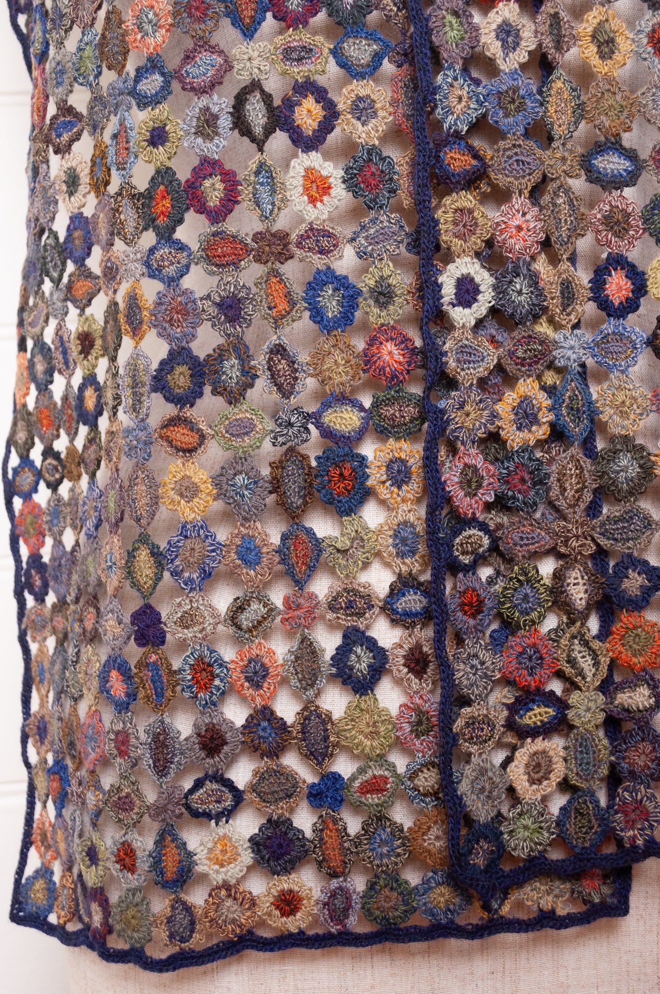 Sophie Digard crocheted wool scarf featuring flower motif lattice in ink palette.
