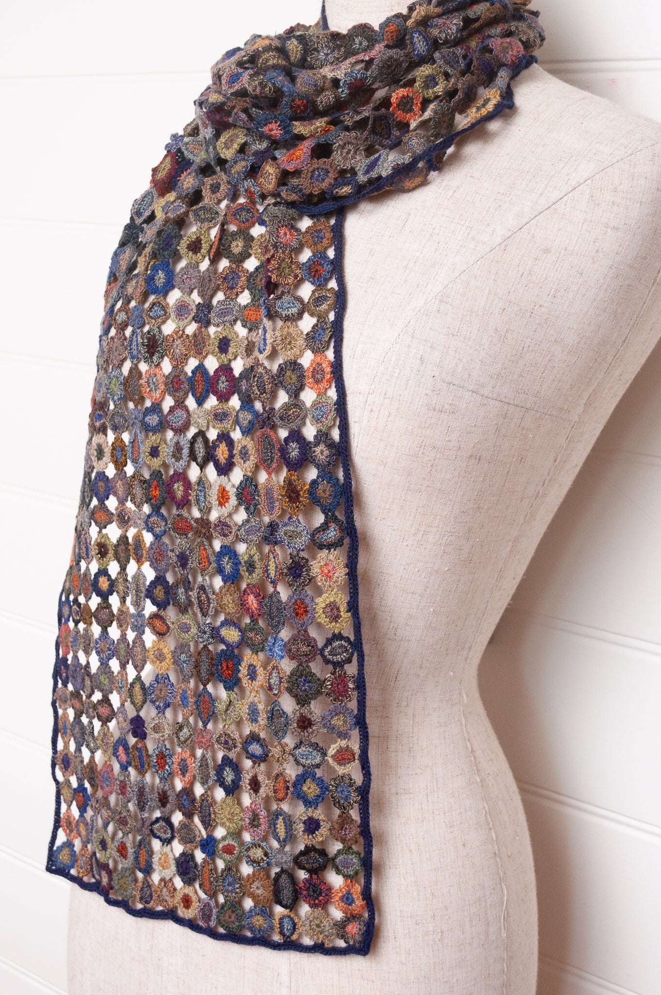 Sophie Digard crocheted wool scarf featuring flower motif lattice in ink palette.