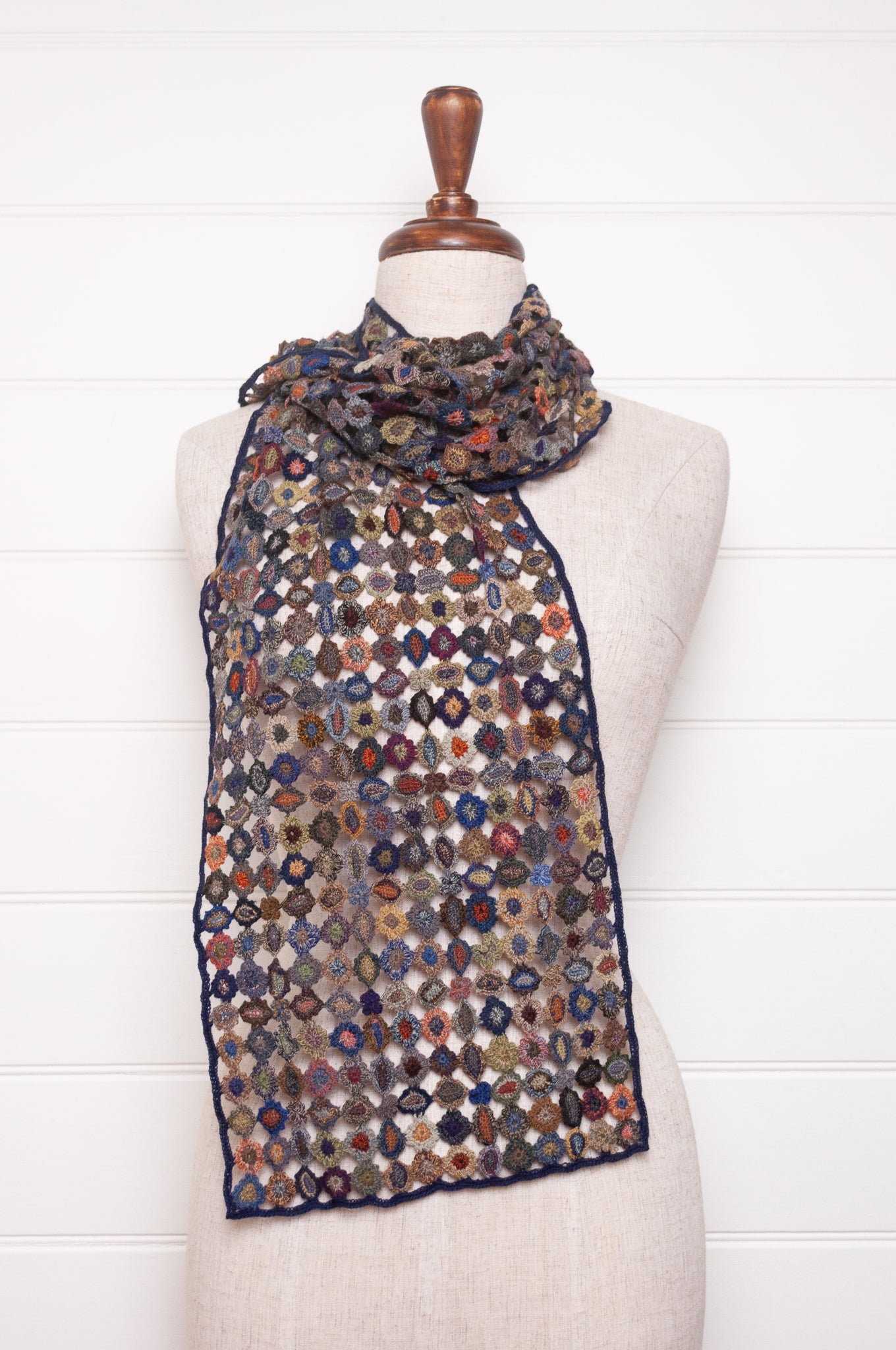 Sophie Digard crocheted wool scarf featuring flower motif lattice in ink palette.