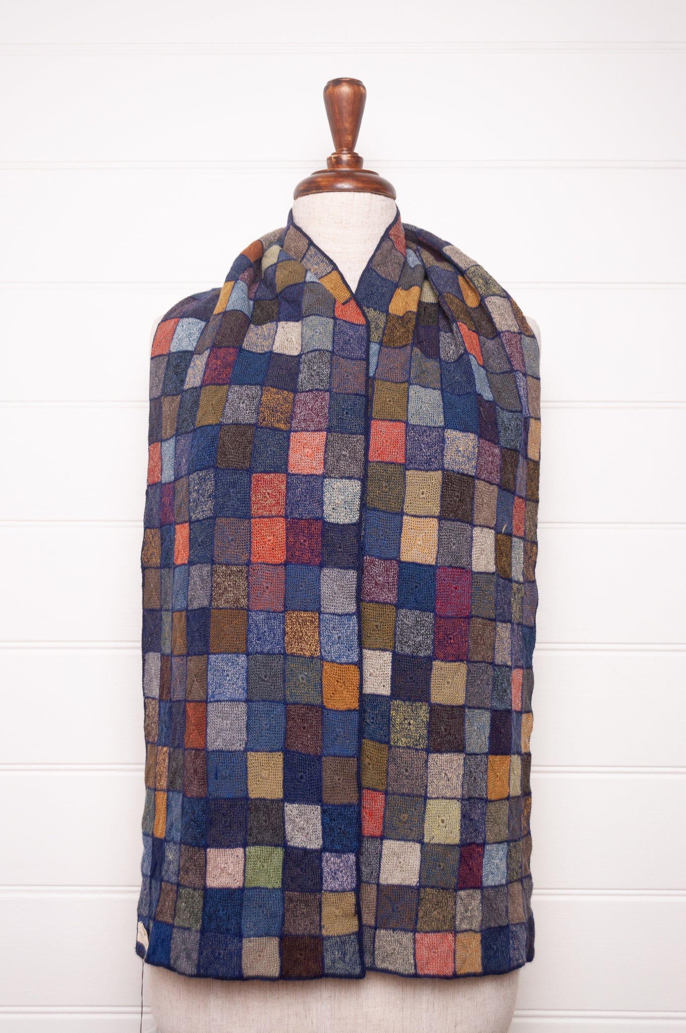 Sophie Digard crocheted wool scarf featuring patchwork with 3D rosettes in ink palette.