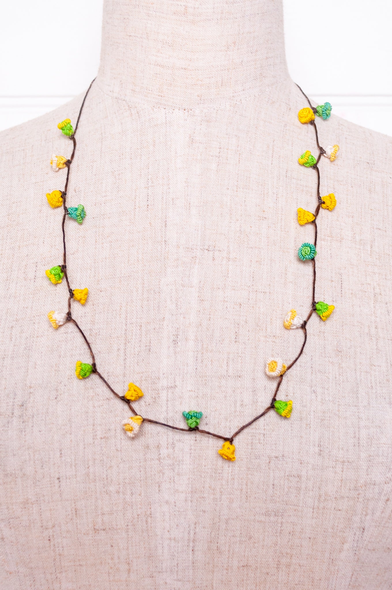 Handmade Moroccan button necklace in lemon yellow and lime green.