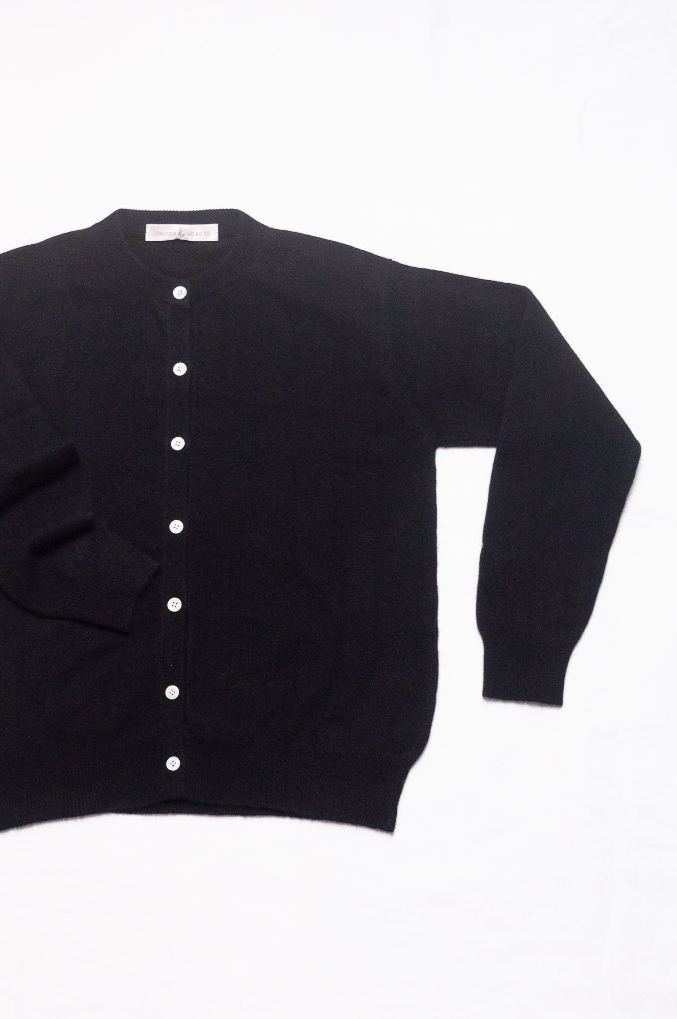 Juniper Hearth classic slimline cashmere cardigan in black.
