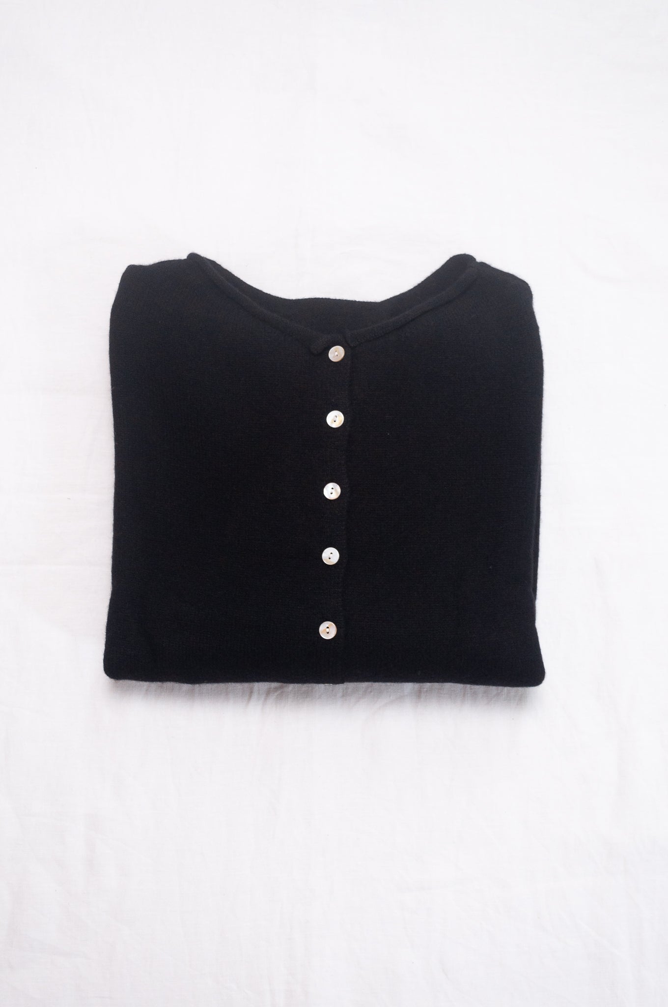 One size reversible cashmere cardigan in black.