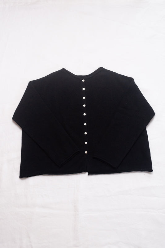 One size reversible cashmere cardigan in black.