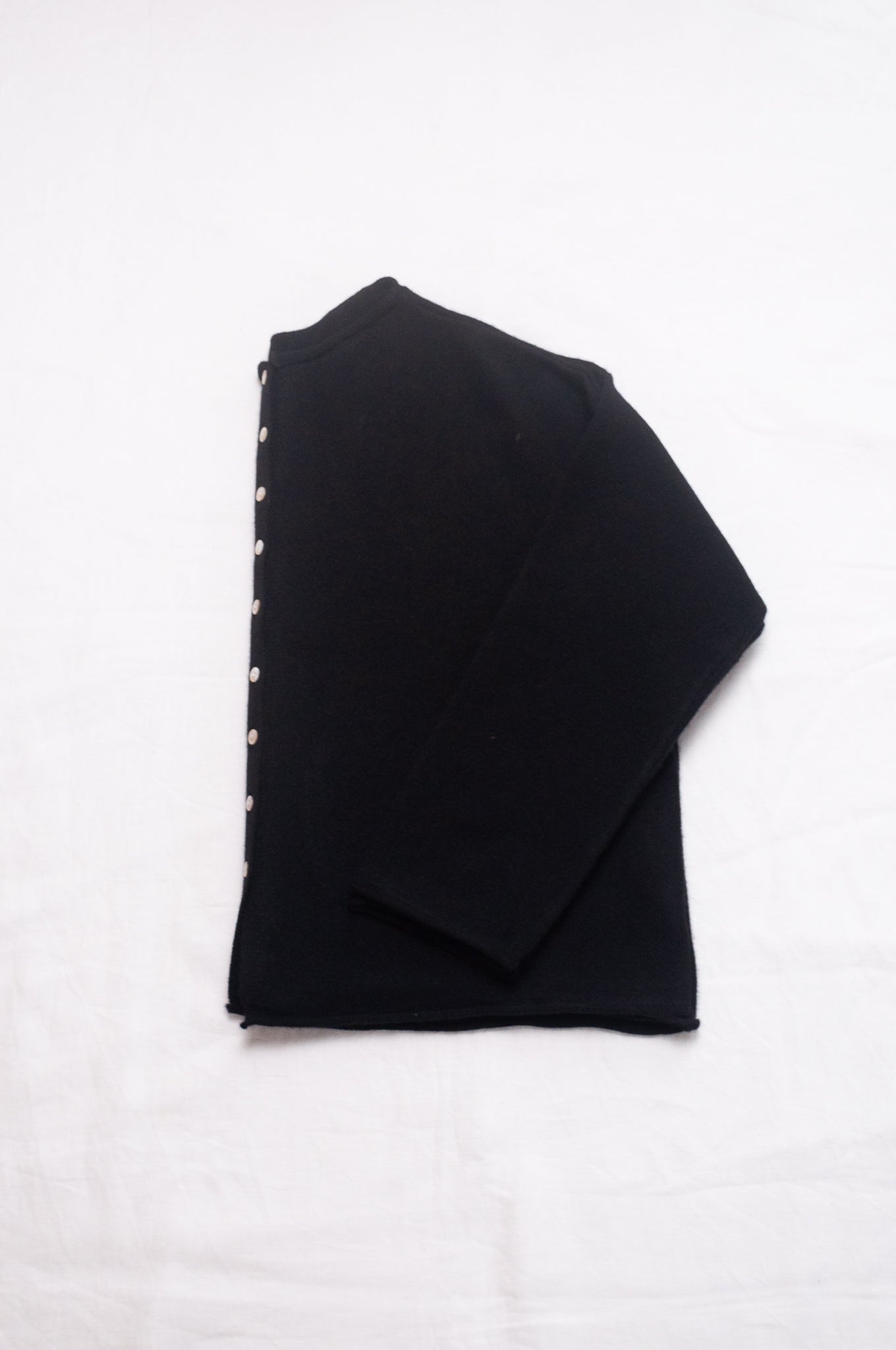 One size reversible cashmere cardigan in black.