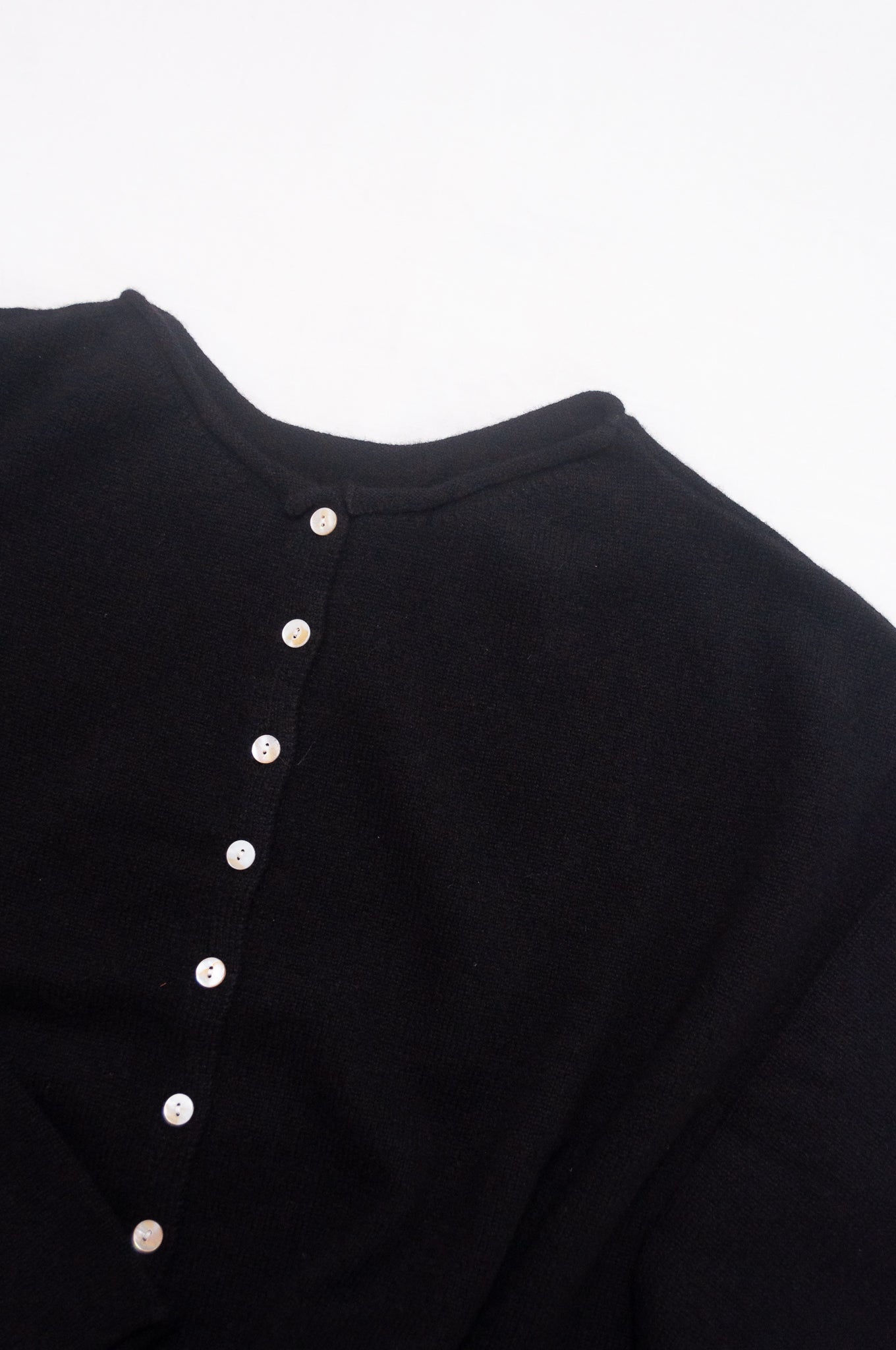 One size reversible cashmere cardigan in black.