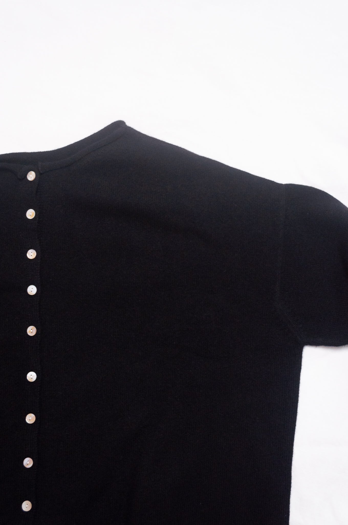 One size reversible cashmere cardigan in black.