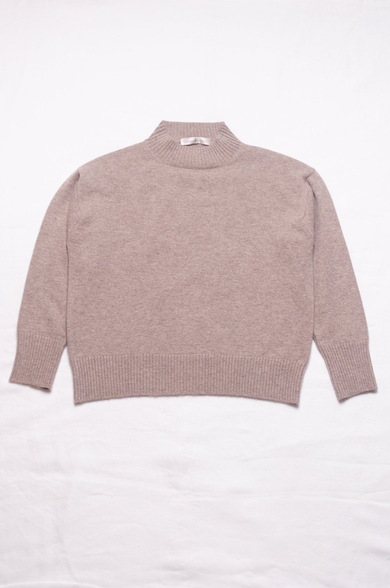 Juniper Hearth high neck turtleneck cashmere sweater in biscuit beige.