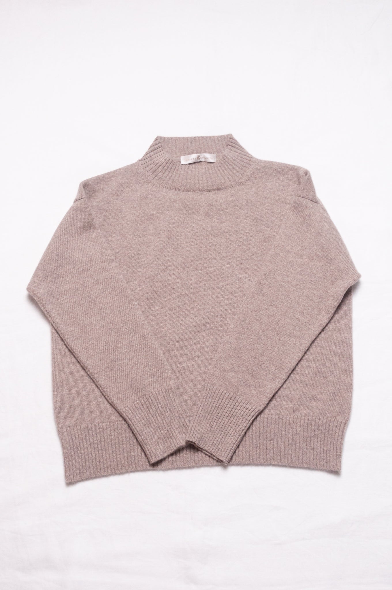 Juniper Hearth high neck turtleneck cashmere sweater in biscuit beige.