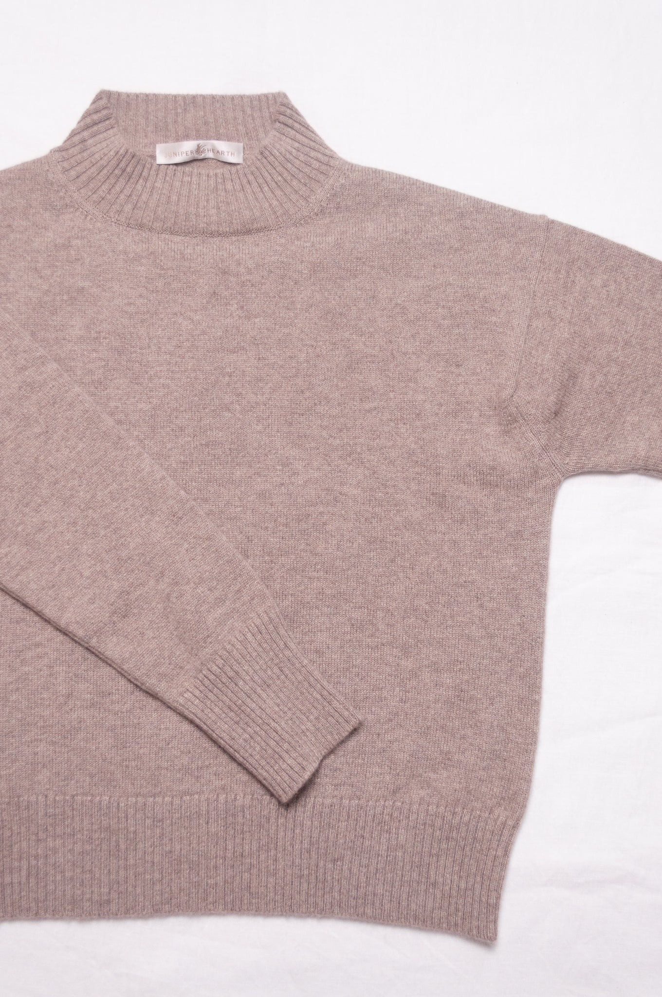 Juniper Hearth high neck turtleneck cashmere sweater in biscuit beige.