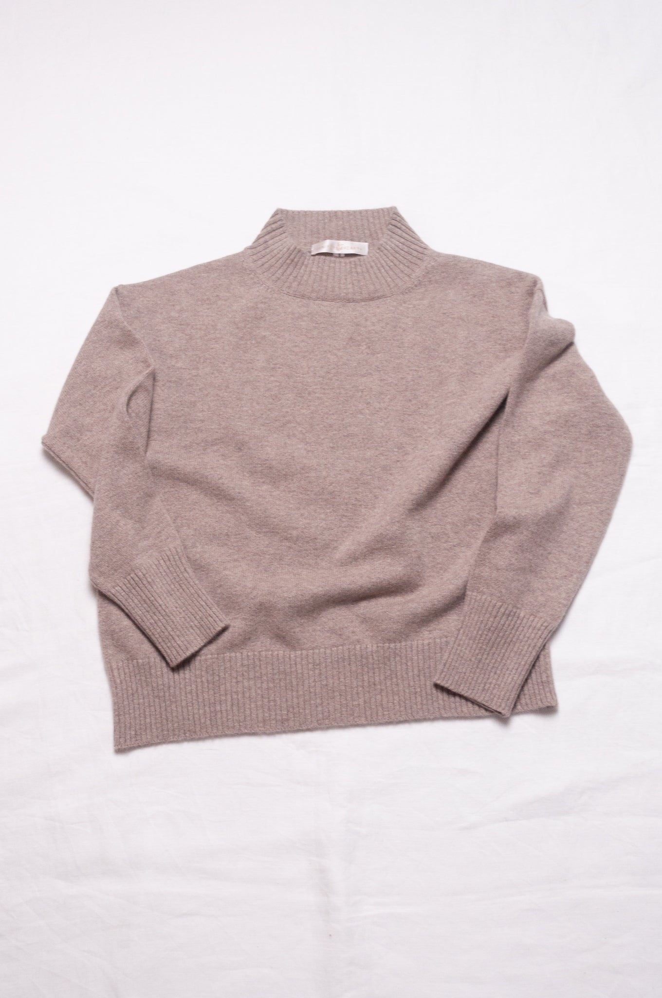 Juniper Hearth high neck turtleneck cashmere sweater in biscuit beige.