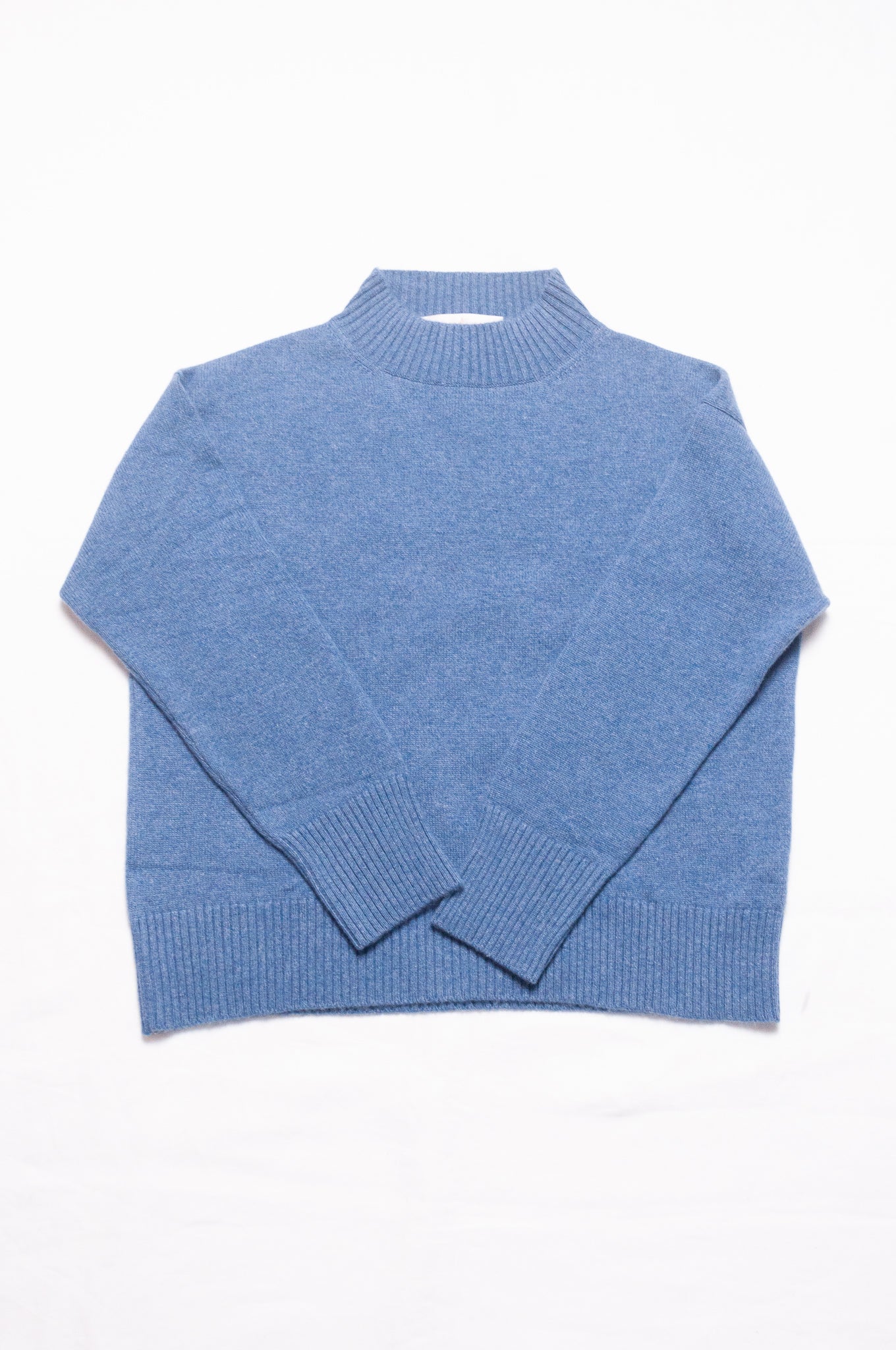 Juniper Hearth high neck turtleneck cashmere sweater in denim blue.