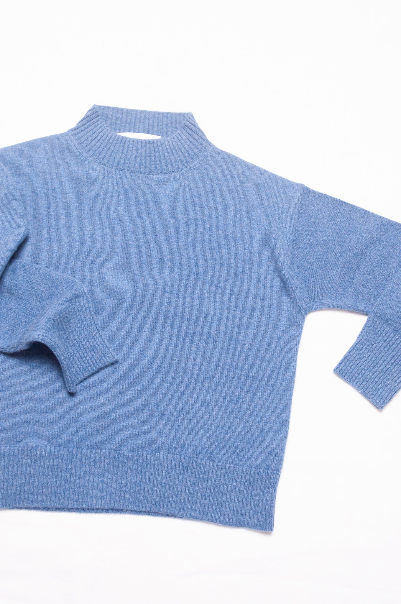Juniper Hearth high neck turtleneck cashmere sweater in denim blue.