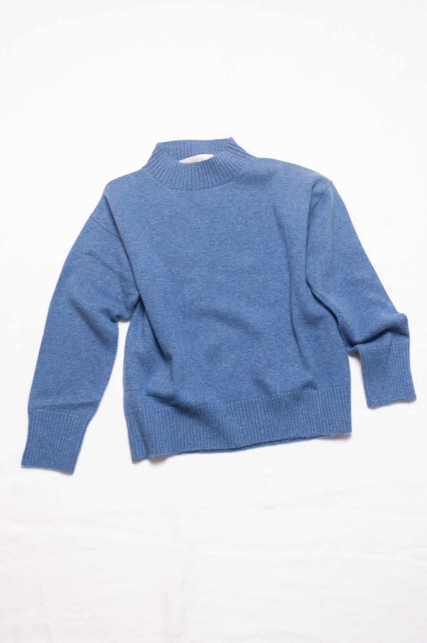 Juniper Hearth high neck turtleneck cashmere sweater in denim blue.