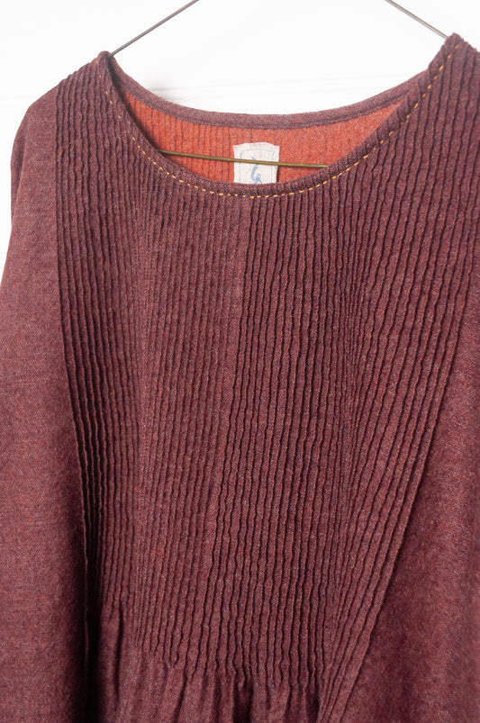 Dve Anisha pintucked top in madder red wool.
