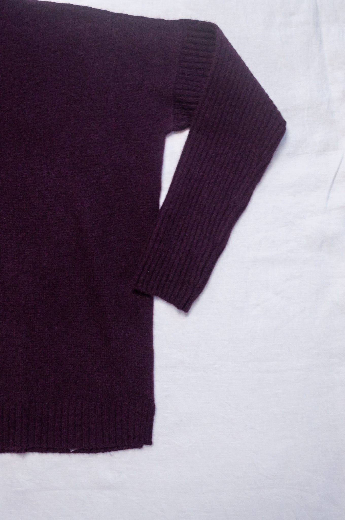 Baby yak wool Maxim one size turtle neck sweater with rib sleeves in aubergine.
