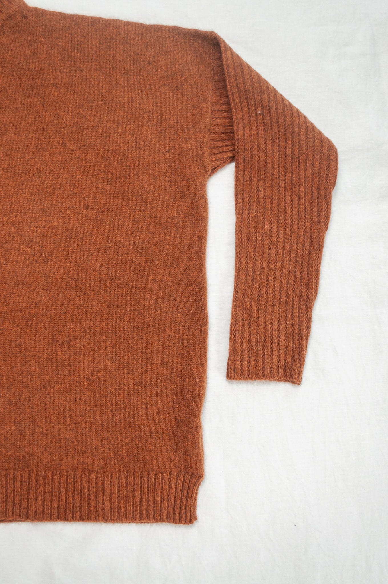 Baby yak wool Maxim one size turtle neck sweater with rib sleeves in rust brown.
