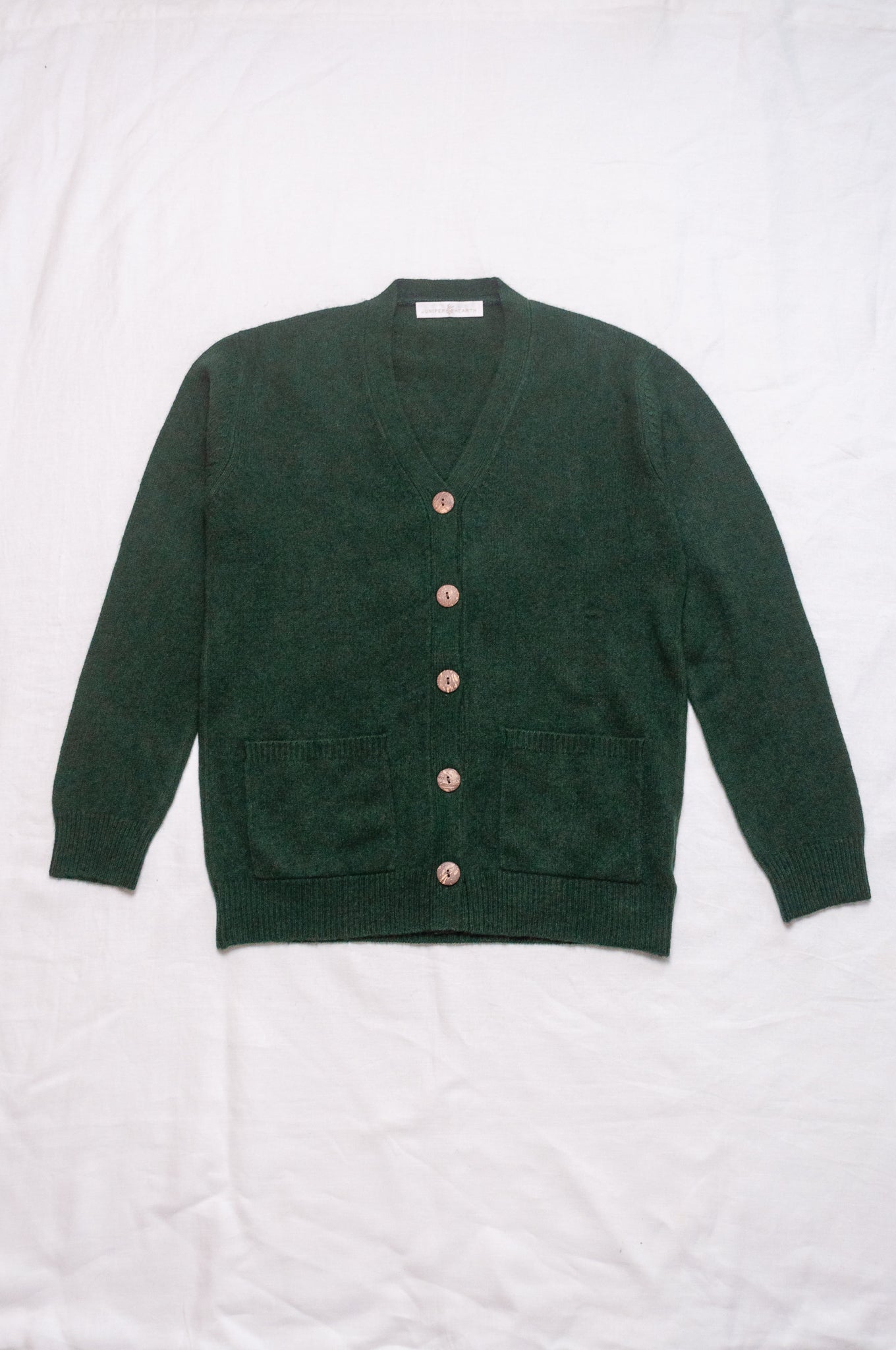 Baby yak wool Ines V-neck button up cardigan in hunter green.
