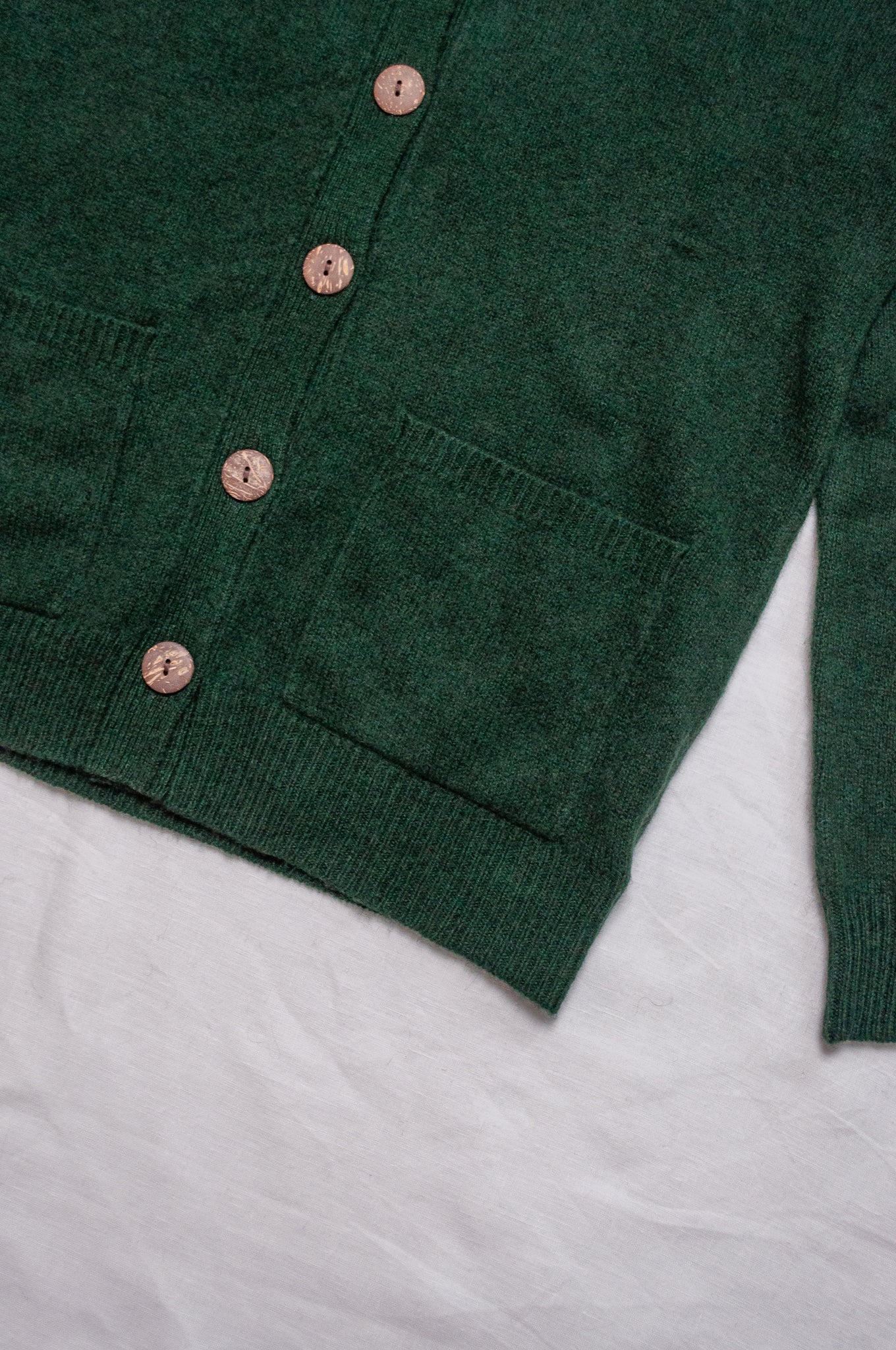 Baby yak wool Ines V-neck button up cardigan in hunter green.