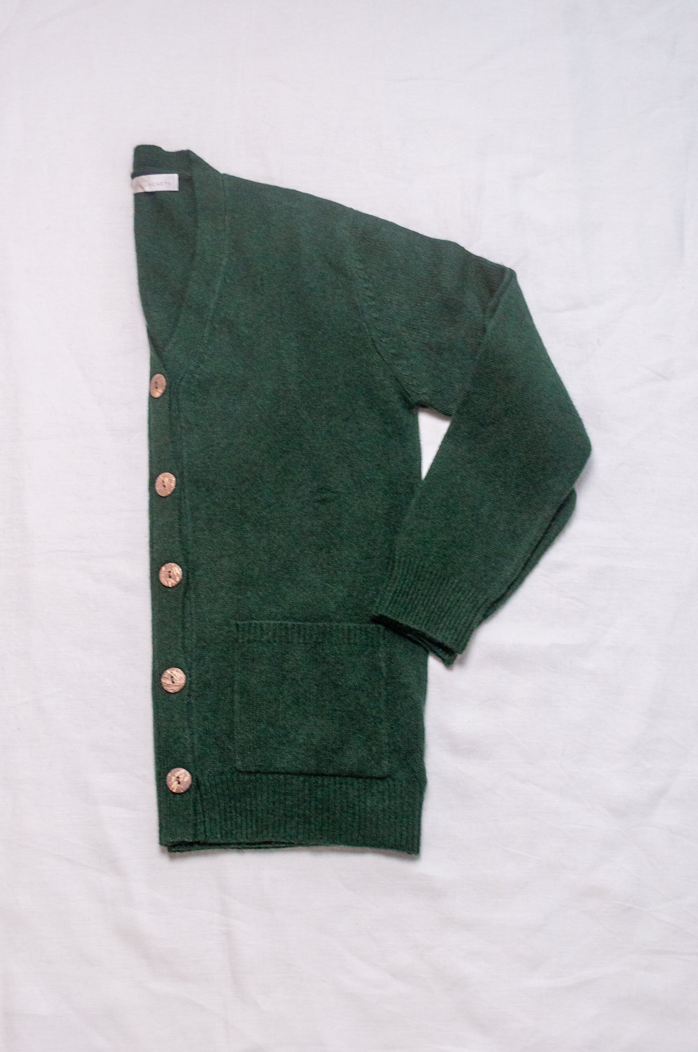 Baby yak wool Ines V-neck button up cardigan in hunter green.