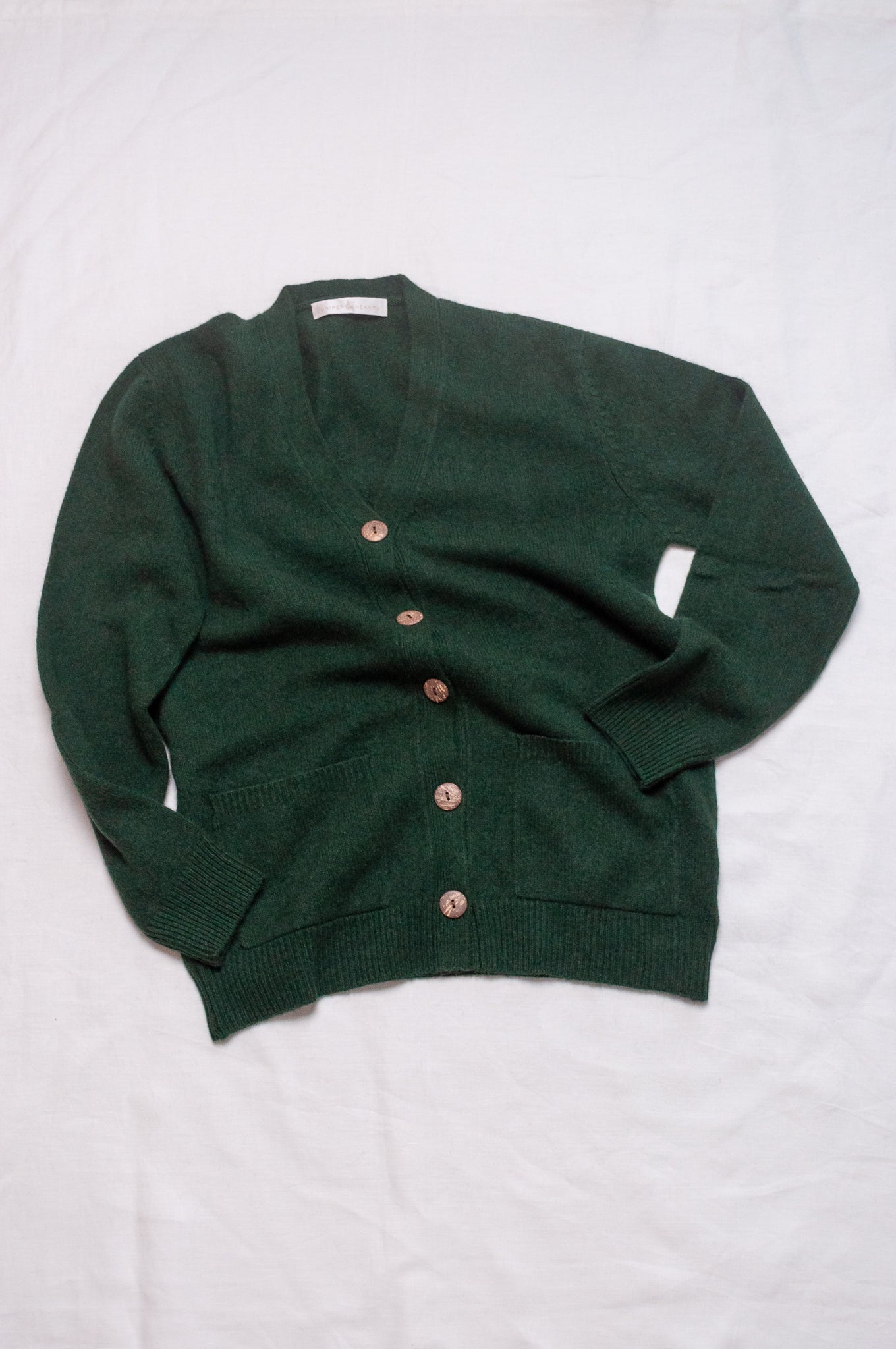 Baby yak wool Ines V-neck button up cardigan in hunter green.