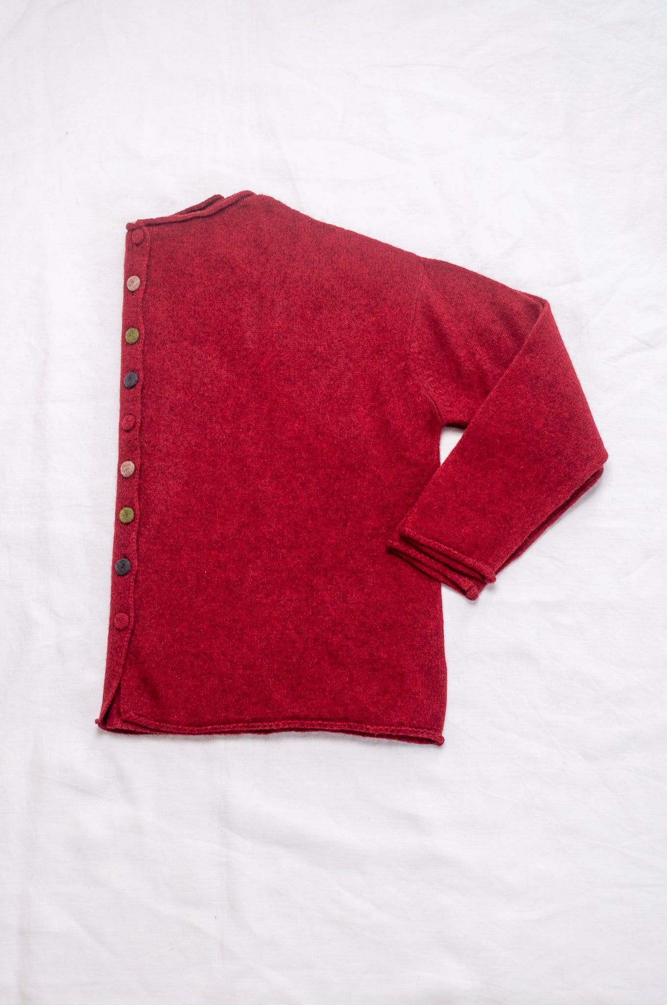 Baby yak one size reversible cardigan sweater with hand embroidered buttons in cherry red.