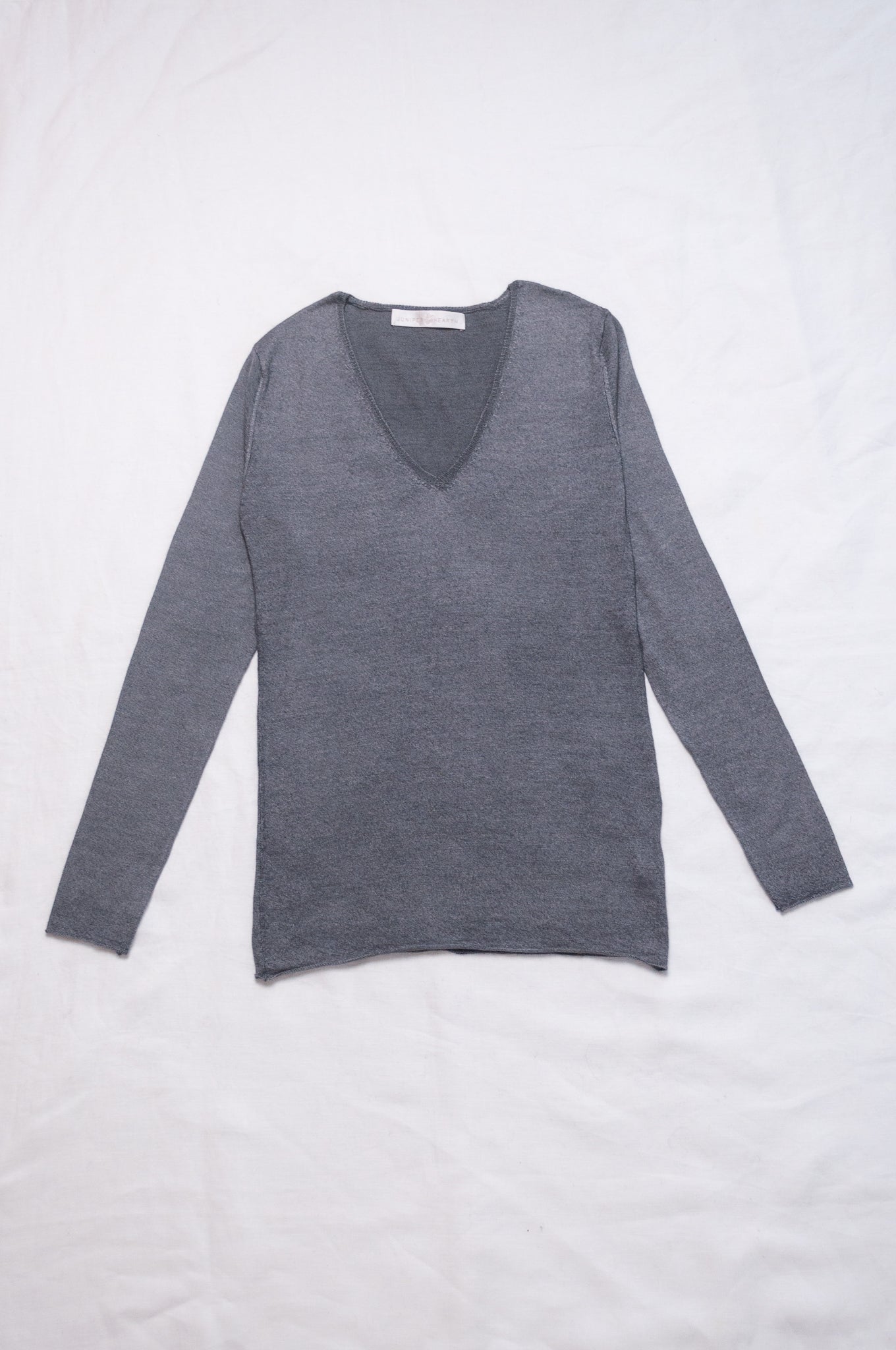 Lightweight pure cashmere sweater skin base layer in dark charcoal grey.