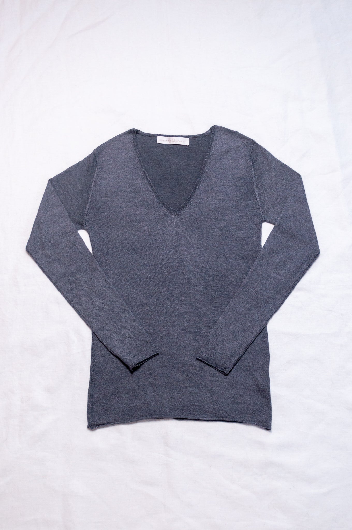Lightweight pure cashmere sweater skin base layer in dark charcoal grey.