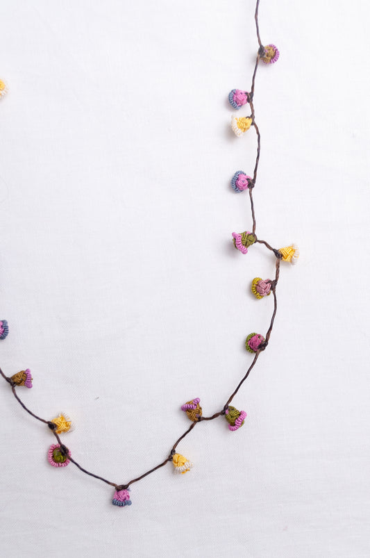 Handmade Moroccan button necklace in  soft pink, lemon and olive.