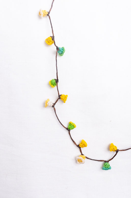 Handmade Moroccan button necklace in  lemon yellow and lime green.