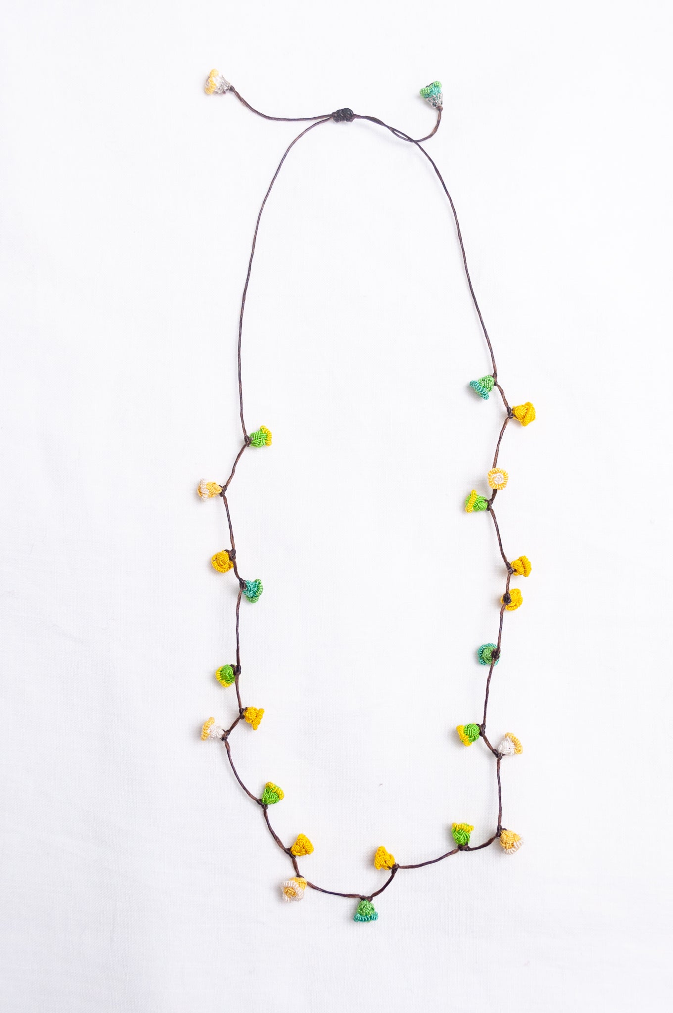 Handmade Moroccan button necklace in lemon yellow and lime green.